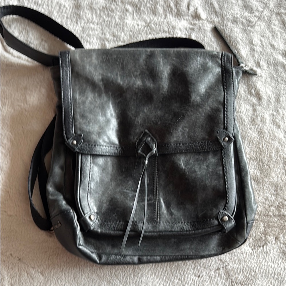 The Sak Black Messenger Bag with Distressed Leather can be crossbody or backpack